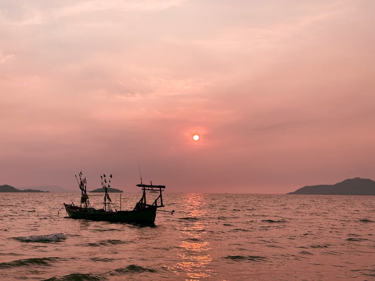 Fishing boat at sunset in Kampot