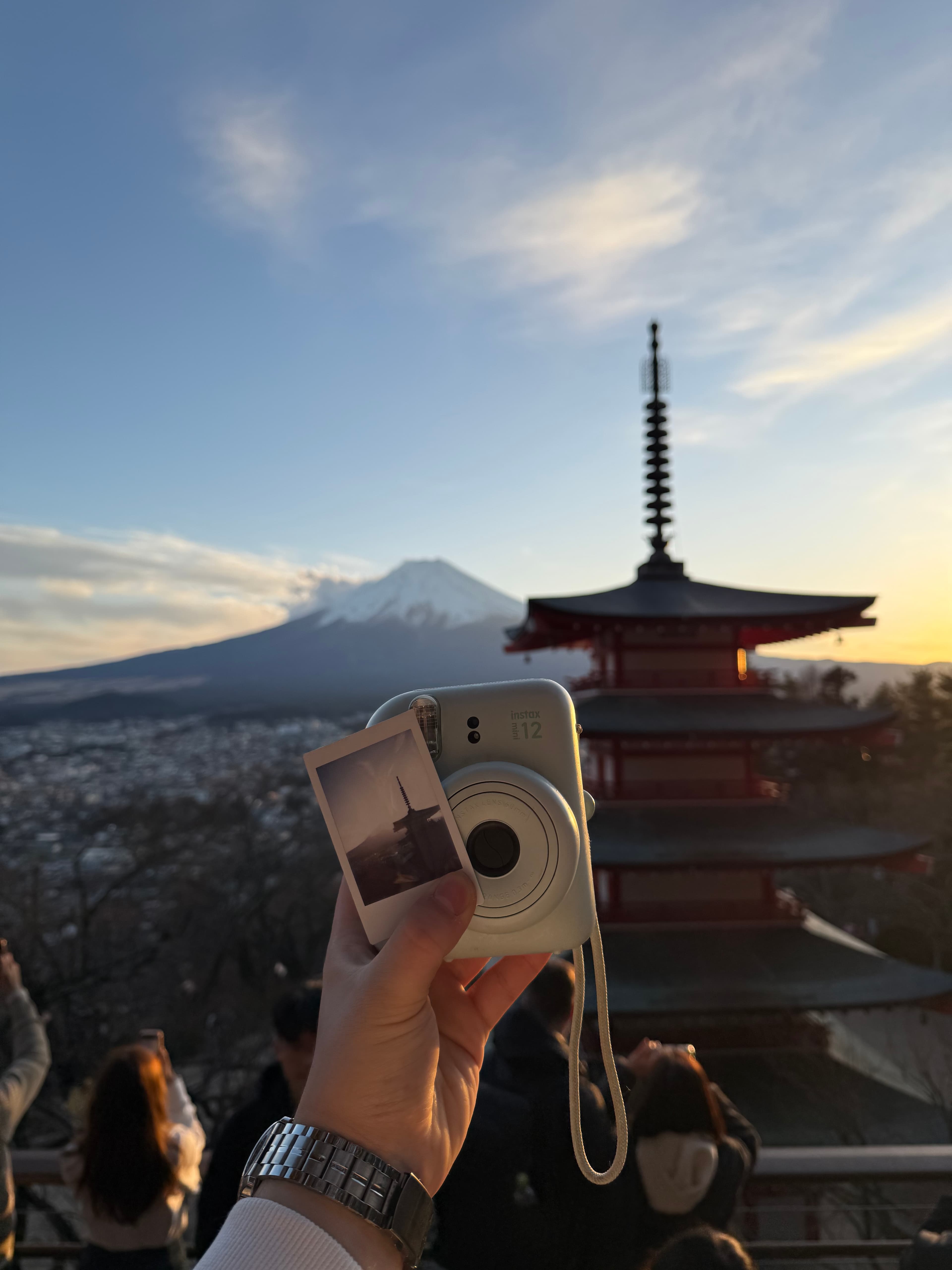 Holding an Instax polaroid at Fujikawaguchiko, Japan
