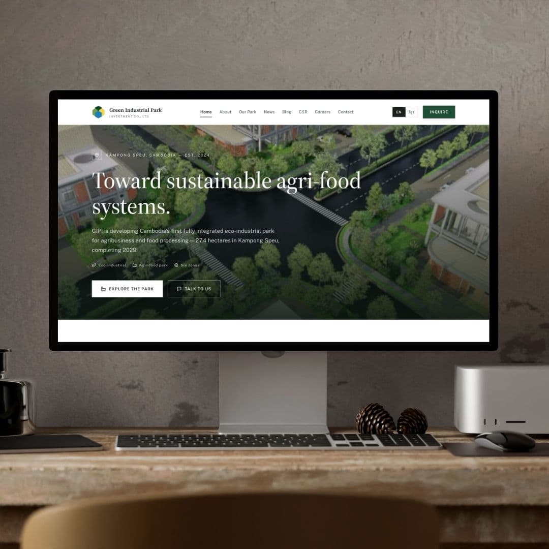 Full desk mockup of the GIPI website on a studio display